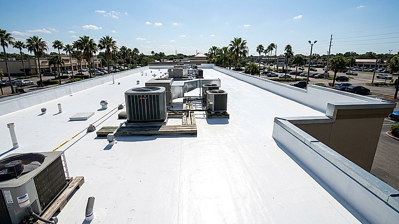 Retail shopping center flat roof silicone restoration in Brandon FL