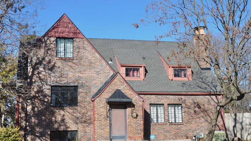 Westchase residential roofline showing clean seamless gutter run along fascia and drip edge