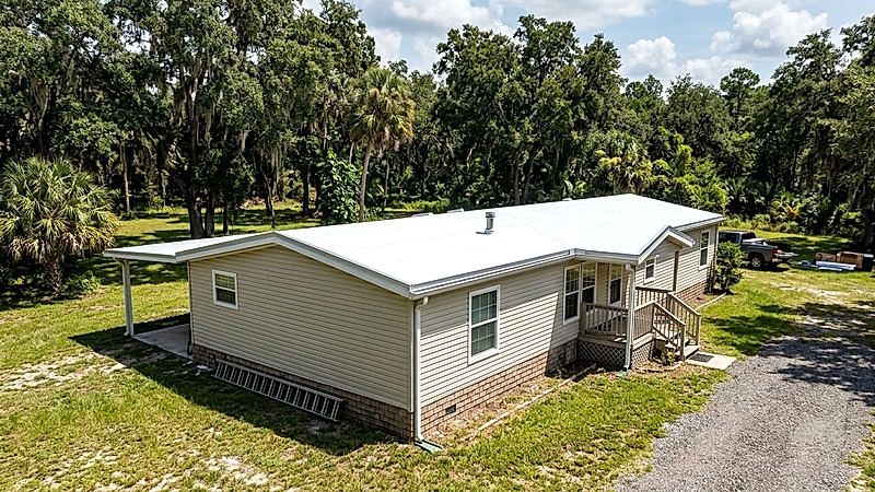 Completed TPO roof over on private acreage manufactured home in Brandon Florida
